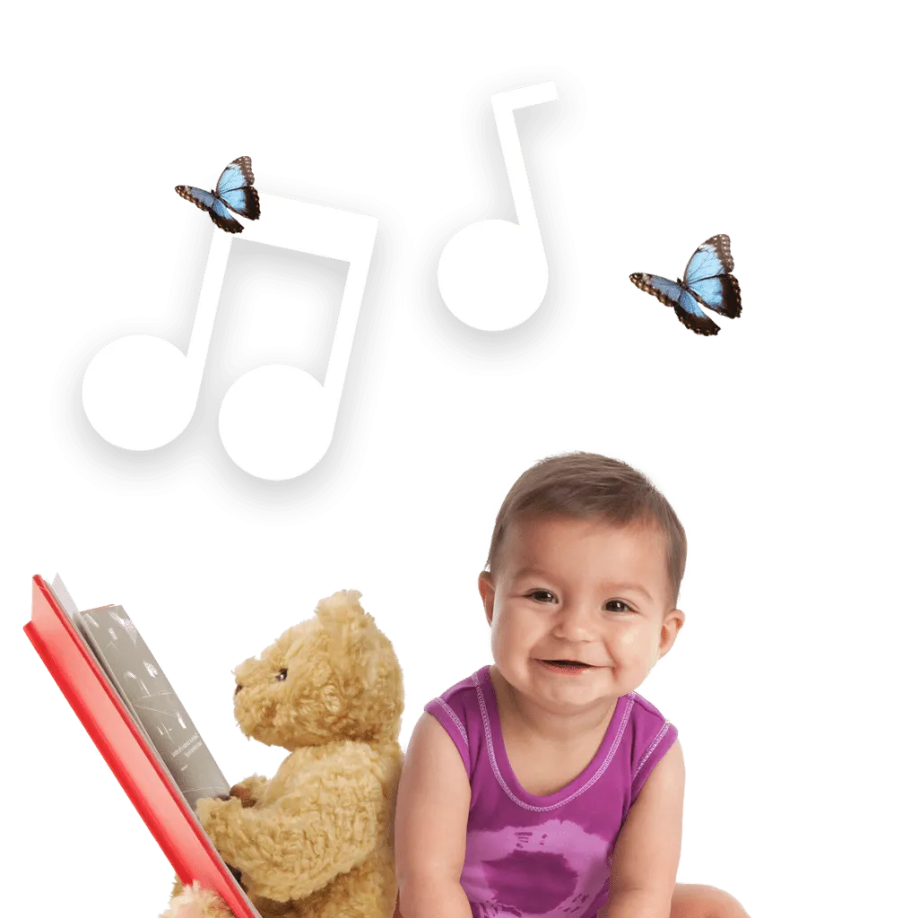 infant sitting with a teddy bear is reading a book